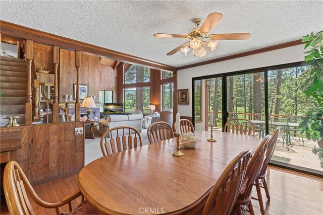 524 Golf Course Rd, Lake Arrowhead, CA 92352 - dining space with wood finished floors, healthy amount of natural light, ceiling fan, a textured ceiling, and crown molding