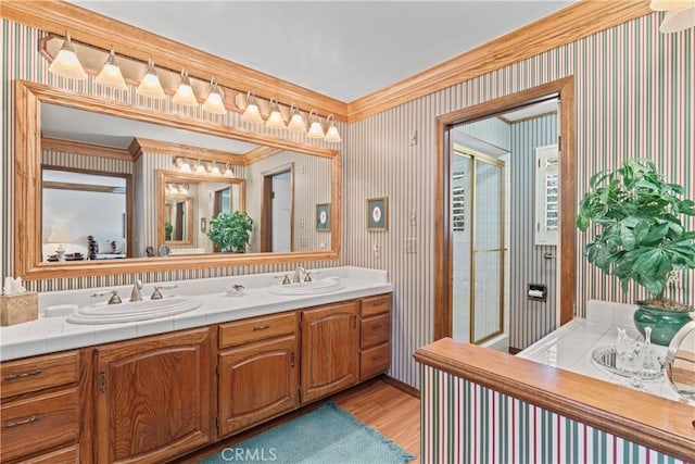 524 Golf Course Rd, Lake Arrowhead, CA 92352 - full bath with double vanity, a stall shower, wood finished floors, wallpapered walls, and crown molding