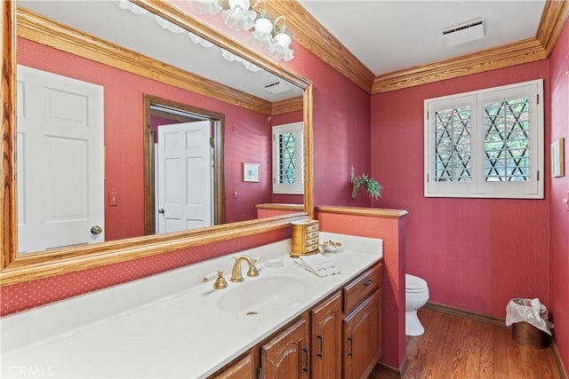 524 Golf Course Rd, Lake Arrowhead, CA 92352 - bathroom featuring toilet, vanity, wood finished floors, plenty of natural light, and ornamental molding