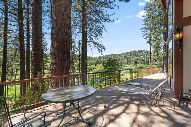 524 Golf Course Rd, Lake Arrowhead, CA 92352 - wooden terrace with a view of trees