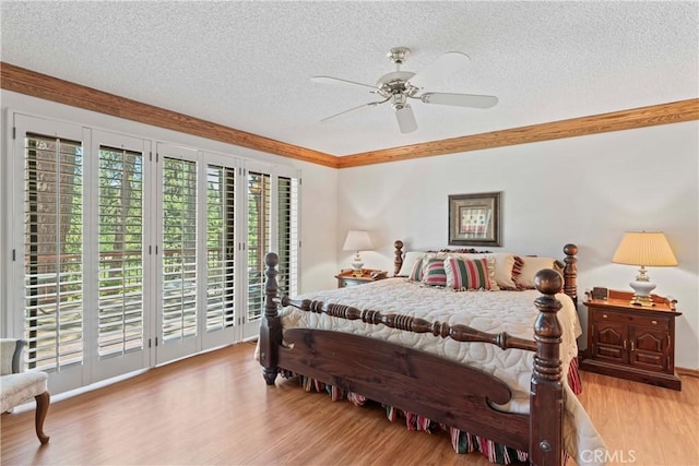 524 Golf Course Rd, Lake Arrowhead, CA 92352 - bedroom featuring access to outside, a textured ceiling, wood finished floors, a ceiling fan, and crown molding