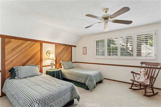 524 Golf Course Rd, Lake Arrowhead, CA 92352 - bedroom featuring a textured ceiling, carpet floors, vaulted ceiling, wood walls, and baseboards