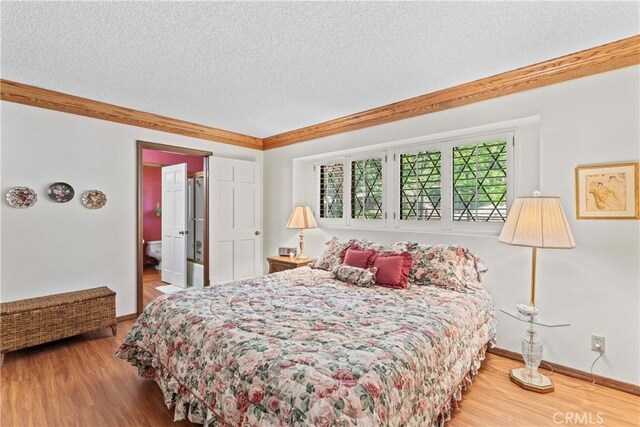 524 Golf Course Rd, Lake Arrowhead, CA 92352 - bedroom featuring a textured ceiling, wood finished floors, baseboards, and crown molding