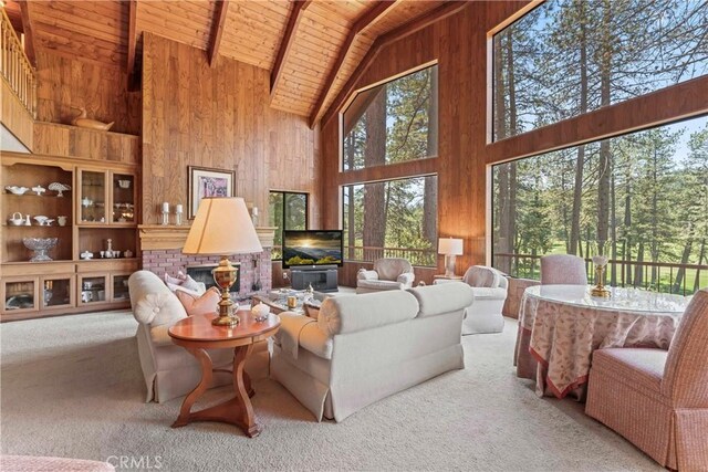 524 Golf Course Rd, Lake Arrowhead, CA 92352 - living room featuring high vaulted ceiling, wooden ceiling with exposed beams, wooden walls, and carpet