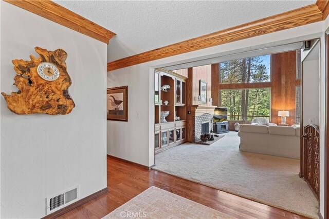 524 Golf Course Rd, Lake Arrowhead, CA 92352 - hall featuring a textured ceiling, wood finished floors, and baseboards