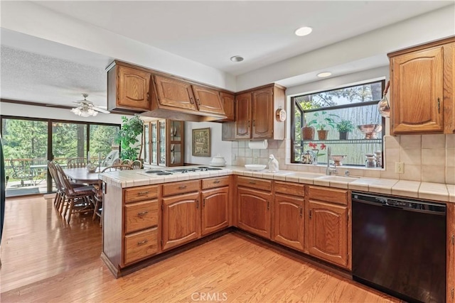 524 Golf Course Rd, Lake Arrowhead, CA 92352 - kitchen with dishwasher, white cooktop, a sink, light wood-style floors, and healthy amount of natural light
