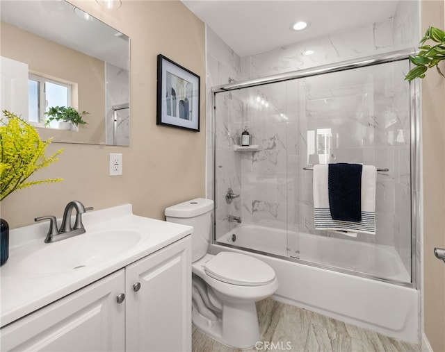 565 N Meridian Ave, San Bernardino, CA 92410 - bathroom with combined bath / shower with glass door, toilet, vanity, and recessed lighting