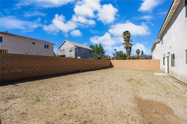 565 N Meridian Ave, San Bernardino, CA 92410 - fenced backyard featuring a residential view