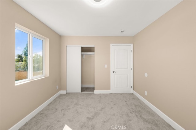 565 N Meridian Ave, San Bernardino, CA 92410 - unfurnished bedroom featuring baseboards, carpet floors, and a closet