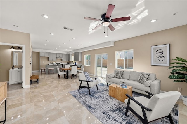 565 N Meridian Ave, San Bernardino, CA 92410 - living area with light marble finish floors, recessed lighting, ceiling fan, and baseboards