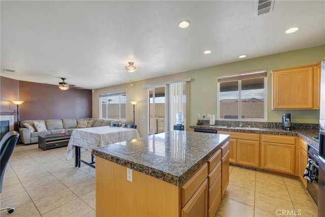 13324 Morningside St, Hesperia, CA 92344 - kitchen featuring healthy amount of natural light, light tile patterned floors, a center island, open floor plan, and recessed lighting