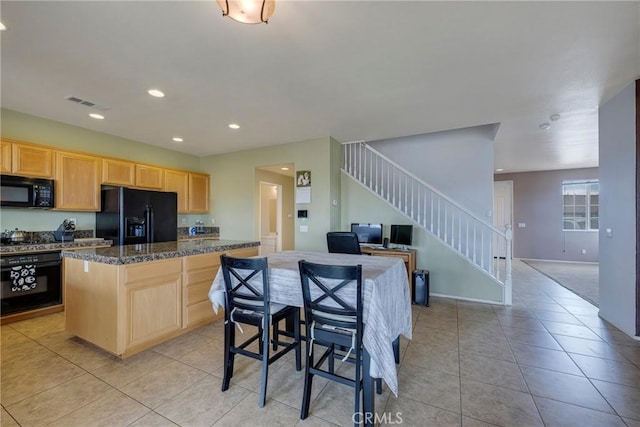 13324 Morningside St, Hesperia, CA 92344 - kitchen with black appliances, light brown cabinetry, dark countertops, light tile patterned flooring, and recessed lighting