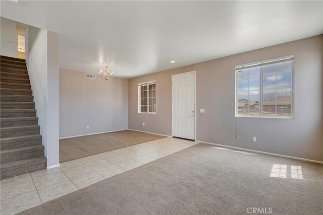 13324 Morningside St, Hesperia, CA 92344 - unfurnished living room with carpet floors, tile patterned floors, a chandelier, stairs, and baseboards