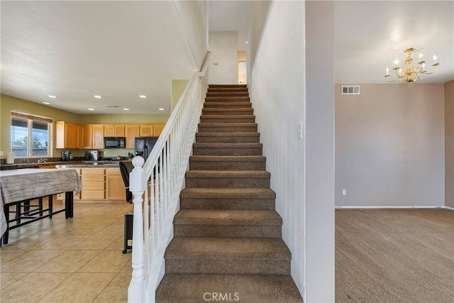 13324 Morningside St, Hesperia, CA 92344 - stairs featuring tile patterned flooring, a chandelier, recessed lighting, and baseboards