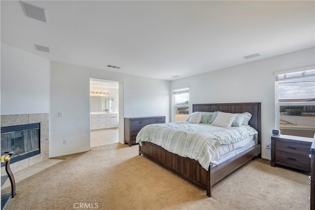 13324 Morningside St, Hesperia, CA 92344 - bedroom with light carpet, a fireplace, and ensuite bath