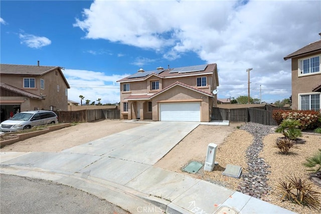 13324 Morningside St, Hesperia, CA 92344 - traditional-style house featuring driveway, roof mounted solar panels, stucco siding, and a tile roof