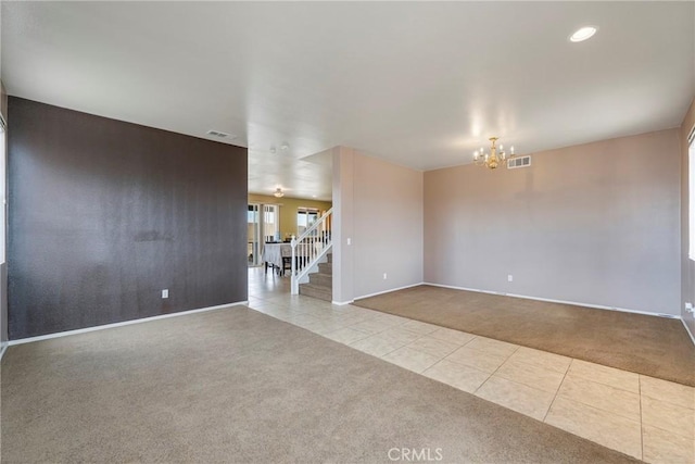 13324 Morningside St, Hesperia, CA 92344 - carpeted empty room featuring tile patterned floors, baseboards, a chandelier, stairs, and recessed lighting