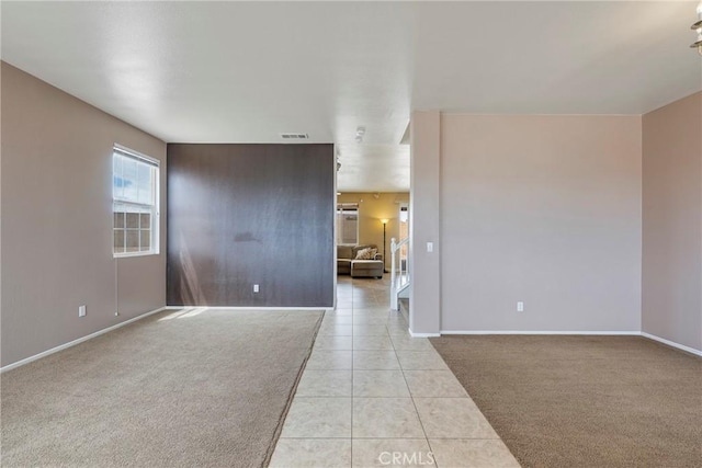 13324 Morningside St, Hesperia, CA 92344 - unfurnished room with light carpet, light tile patterned flooring, and baseboards