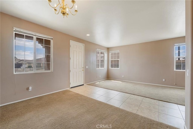 13324 Morningside St, Hesperia, CA 92344 - empty room featuring carpet, a chandelier, baseboards, tile patterned floors, and recessed lighting