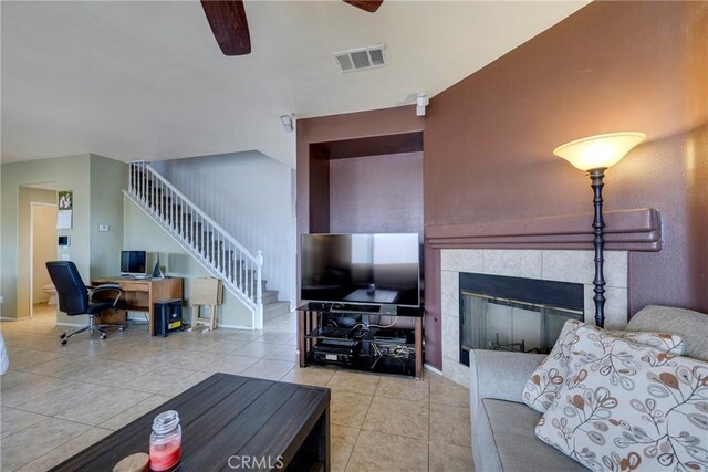 13324 Morningside St, Hesperia, CA 92344 - living area featuring ceiling fan, light tile patterned flooring, stairs, a tile fireplace, and an office area