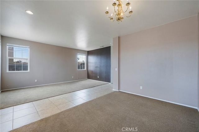 13324 Morningside St, Hesperia, CA 92344 - carpeted spare room featuring tile patterned flooring, a chandelier, and baseboards