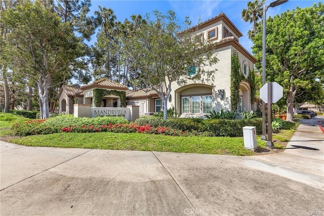 2800 Keller Dr Unit 282, Tustin, CA 92782 - view of front of home with a tiled roof and stucco siding