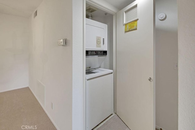 2800 Keller Dr Unit 282, Tustin, CA 92782 - laundry area featuring estacked washer and dryer and light colored carpet