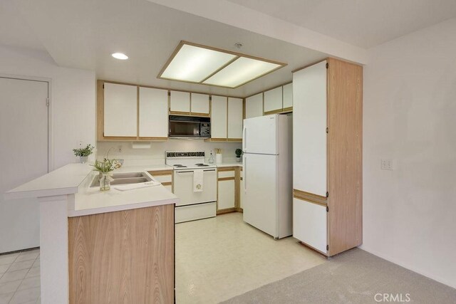 2800 Keller Dr Unit 282, Tustin, CA 92782 - kitchen featuring white appliances, light countertops, a peninsula, and recessed lighting