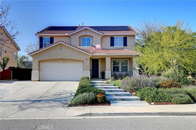 19068 Sunflower Pl, Riverside, CA 92508 - view of front of home featuring covered porch, stucco siding, concrete driveway, and solar panels