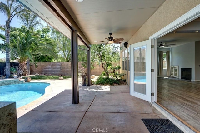 19068 Sunflower Pl, Riverside, CA 92508 - view of swimming pool with a ceiling fan, a fenced backyard, and a patio area