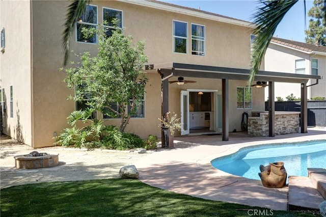 19068 Sunflower Pl, Riverside, CA 92508 - rear view of property with stucco siding, a ceiling fan, a patio area, and an outdoor pool