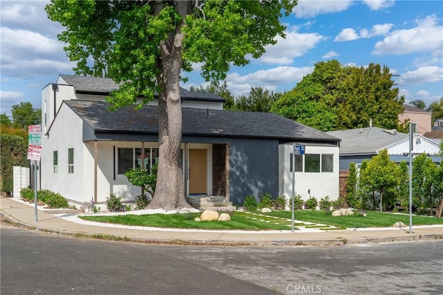 2536 Cotner Ave, Los Angeles, CA 90064 - view of front of home with a front yard, a shingled roof, and stucco siding