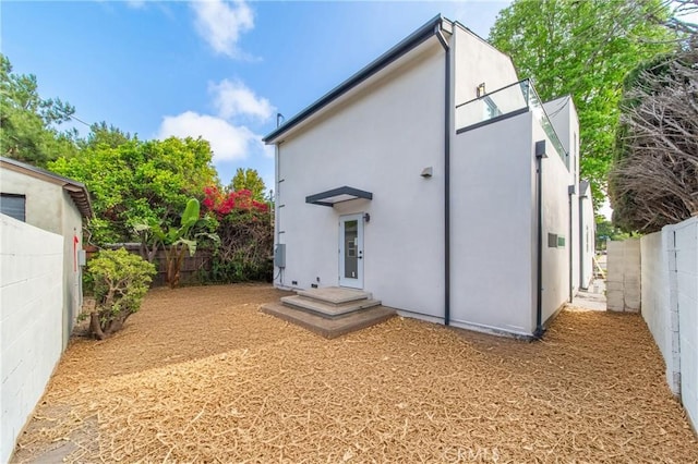 2536 Cotner Ave, Los Angeles, CA 90064 - rear view of house featuring a fenced backyard and stucco siding