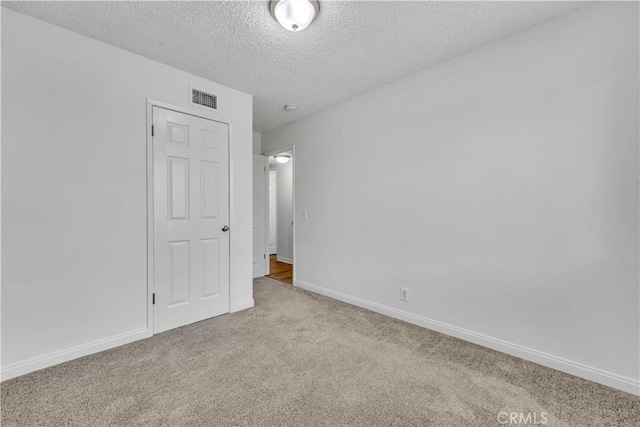 45121 17th St W, Lancaster, CA 93534 - unfurnished bedroom with carpet floors and a textured ceiling