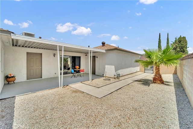 45121 17th St W, Lancaster, CA 93534 - back of house featuring stucco siding, a patio area, and a fenced backyard