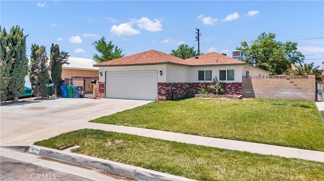 45121 17th St W, Lancaster, CA 93534 - ranch-style home with a garage, driveway, brick siding, and stucco siding