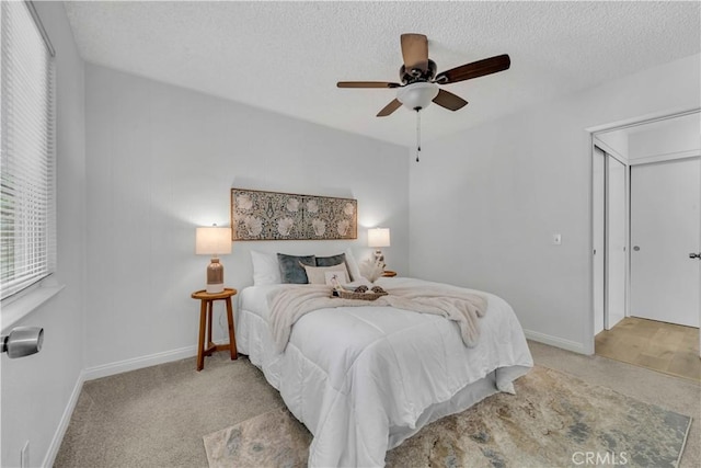 45121 17th St W, Lancaster, CA 93534 - bedroom with light colored carpet, a textured ceiling, and ceiling fan