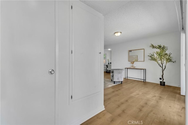 45121 17th St W, Lancaster, CA 93534 - corridor featuring light wood-style floors and a textured ceiling