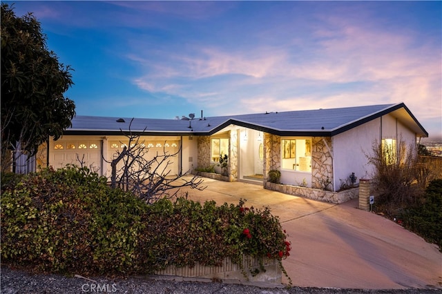 29805 Knoll View Dr, Rancho Palos Verdes, CA 90275 - view of front of house featuring stone siding, concrete driveway, a garage, and stucco siding