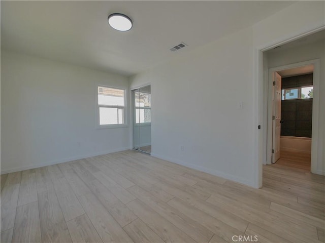 24931 Vine St, San Bernardino, CA 92410 - spare room featuring light wood-type flooring and healthy amount of natural light