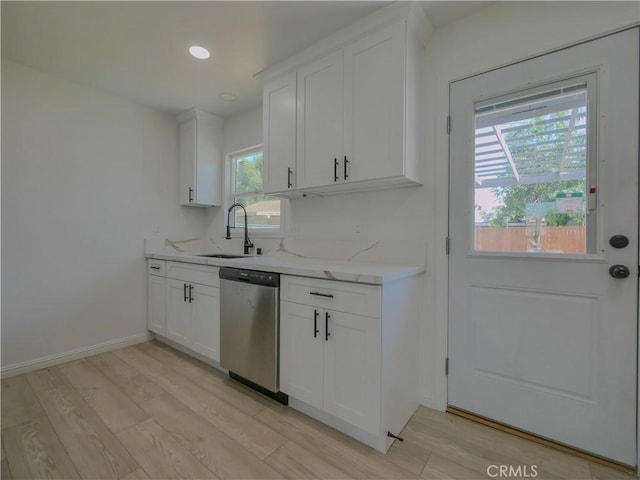 24931 Vine St, San Bernardino, CA 92410 - kitchen with dishwasher, light wood-type flooring, white cabinets, recessed lighting, and light stone countertops