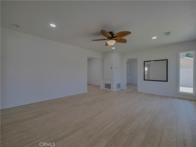 24931 Vine St, San Bernardino, CA 92410 - unfurnished living room with light wood finished floors, a ceiling fan, and recessed lighting