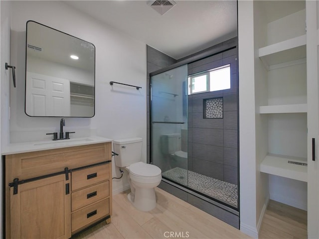 24931 Vine St, San Bernardino, CA 92410 - full bath featuring vanity, a shower stall, and wood finished floors