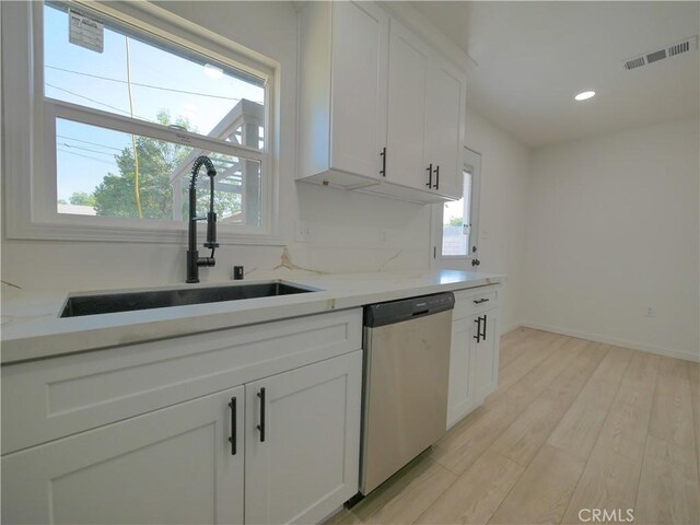 24931 Vine St, San Bernardino, CA 92410 - kitchen featuring stainless steel dishwasher, light wood-style floors, white cabinetry, recessed lighting, and light stone countertops