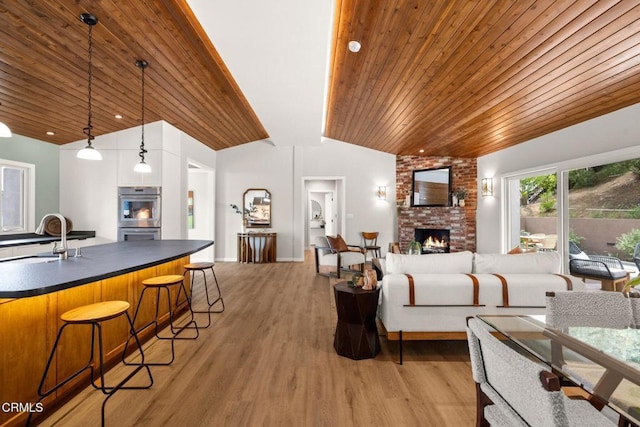 845 Rollin St, South Pasadena, CA 91030 - living area featuring wood ceiling, a fireplace, vaulted ceiling, and light wood-type flooring