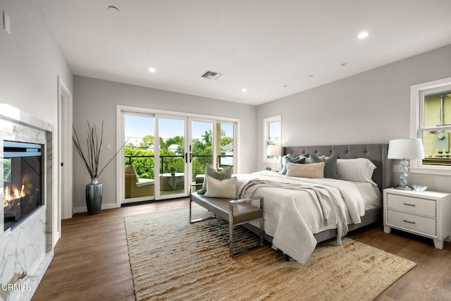 845 Rollin St, South Pasadena, CA 91030 - bedroom featuring access to outside, recessed lighting, wood finished floors, and a premium fireplace