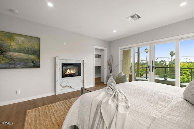 845 Rollin St, South Pasadena, CA 91030 - bedroom with access to outside, multiple windows, recessed lighting, a fireplace, and wood finished floors