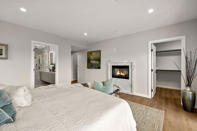 845 Rollin St, South Pasadena, CA 91030 - bedroom featuring a spacious closet, a premium fireplace, wood finished floors, recessed lighting, and ensuite bathroom