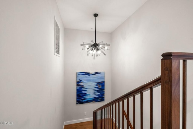 845 Rollin St, South Pasadena, CA 91030 - staircase featuring a chandelier and wood finished floors