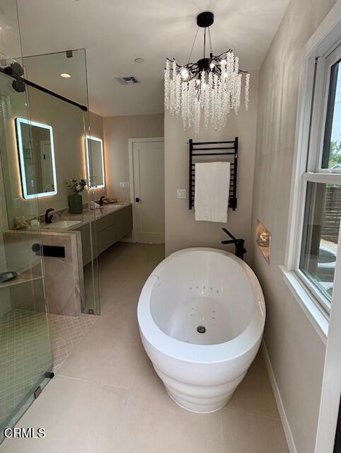 845 Rollin St, South Pasadena, CA 91030 - bathroom featuring tile patterned flooring, a freestanding bath, double vanity, a chandelier, and a stall shower